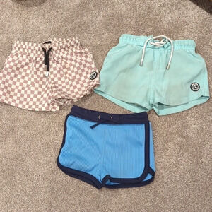 2 pair Binky bro 18mo swim trunks and cat and jack 18 mo swim shorts